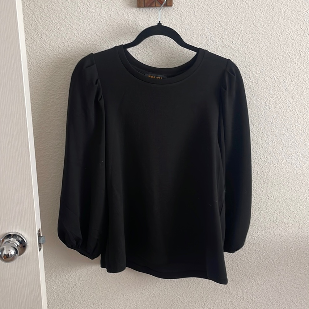 NWOT. Beautiful black sweater like top